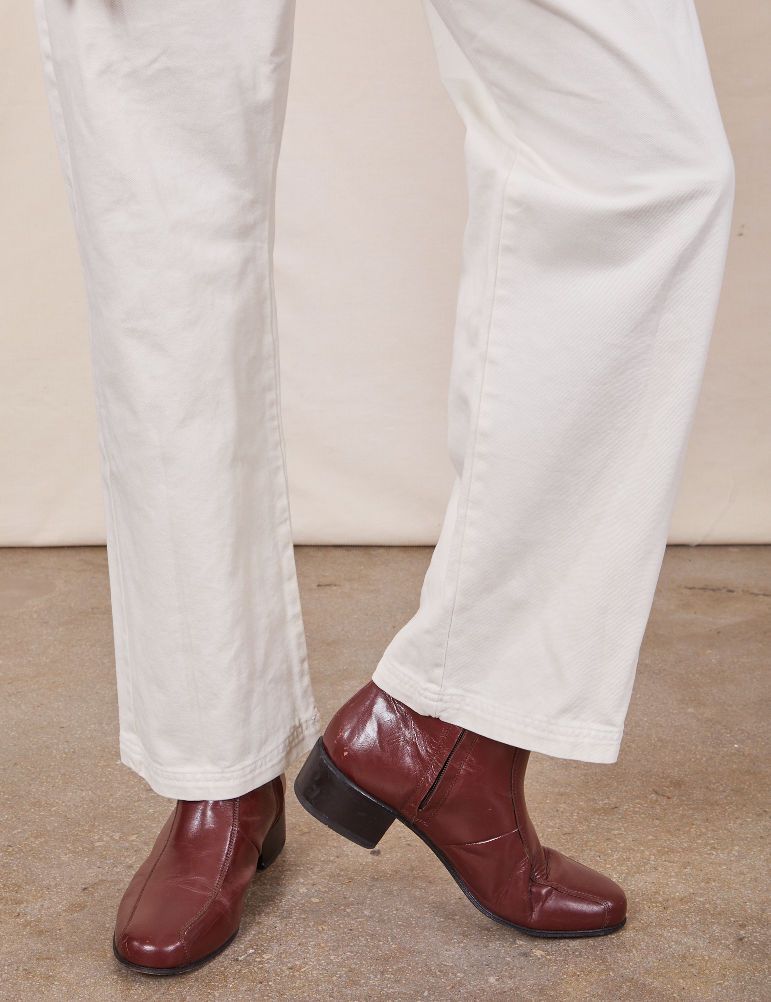 Pant leg close up of Short Sleeve Jumpsuit in Vintage Tee Off-White worn by Jesse