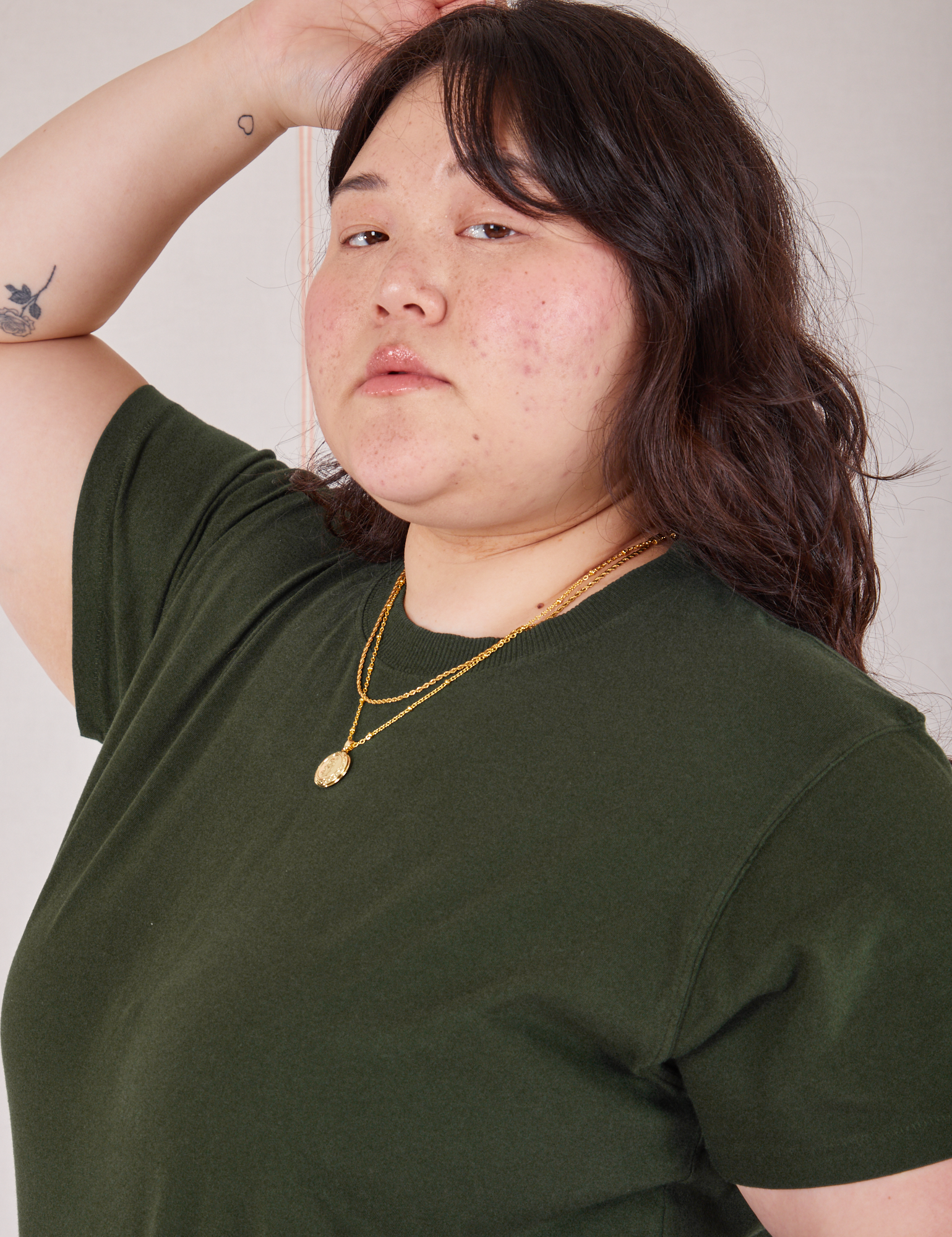 Organic Vintage Tee in Swamp Green close up on Ashley