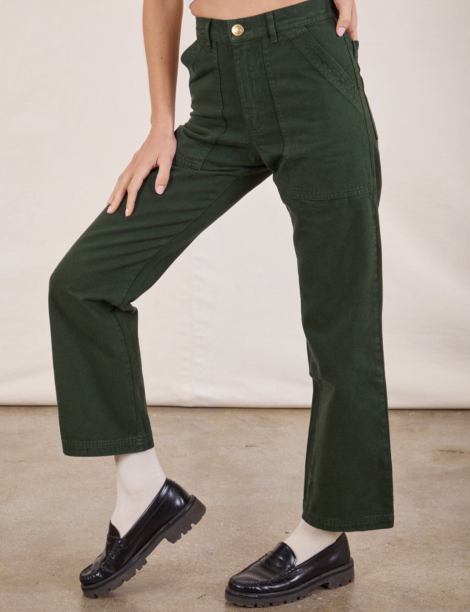 Work Pants in Swamp Green pant leg close up on Madeline