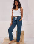 Kandia is 5'3" and wearing P Rolled Cuff Sweat Pants in Lagoon and Cropped Tank in vintage tee off-white