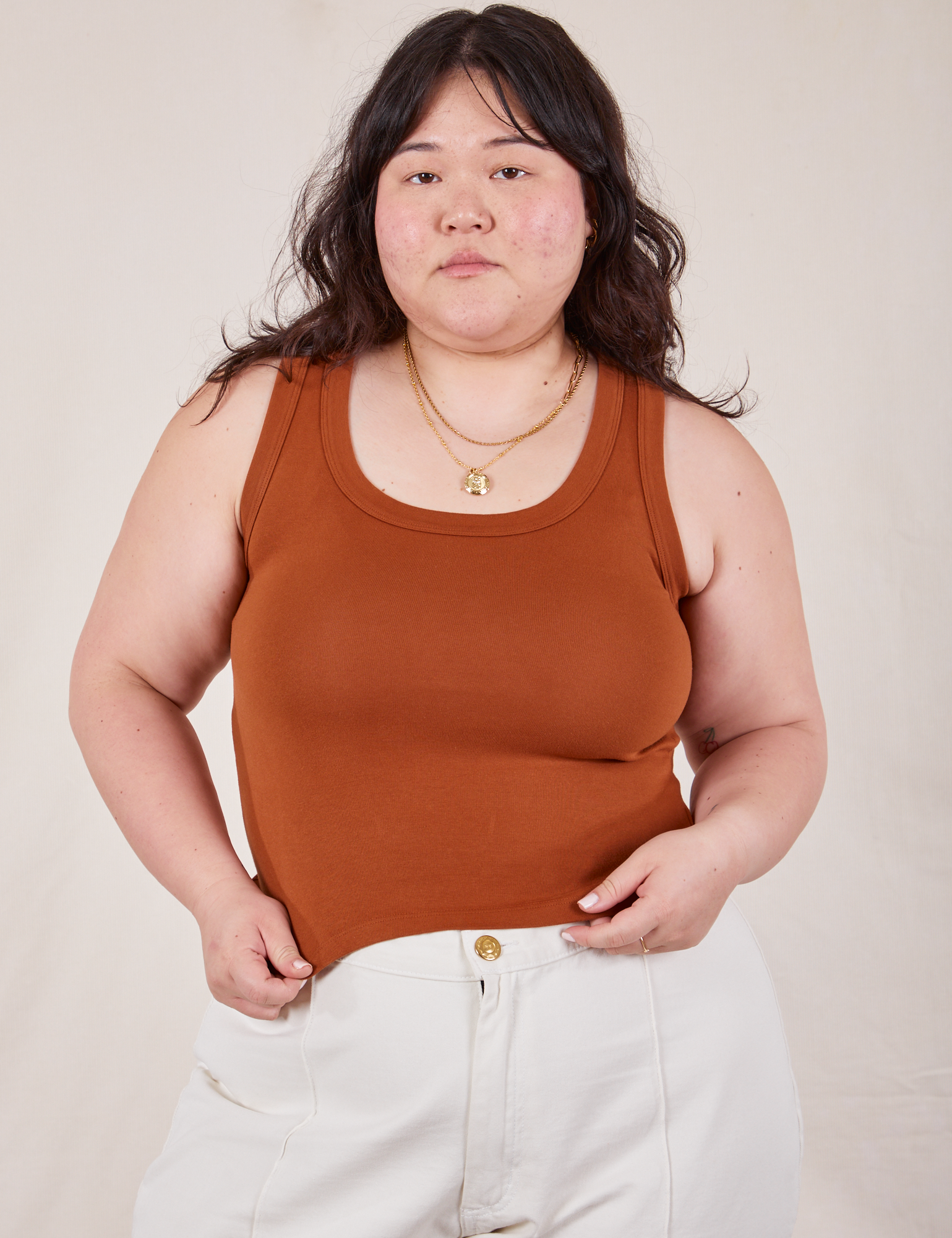 Ashley is 5’7” and wearing L The Tank Top in Burnt Terracotta
