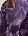Close up of Demi's hand in the back pocket of Magic Waters Drop Pocket Pants in Dark Lavender