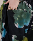 Close up of Sydney's hand in the back pocket of Magic Waters Drop Pocket Pants in Green Pool