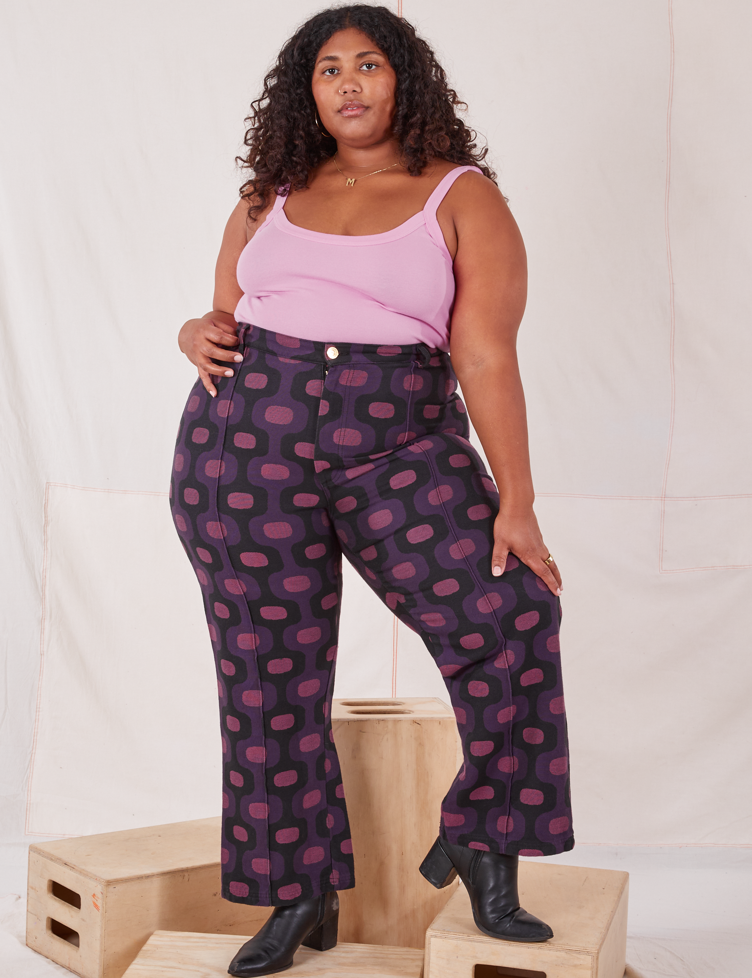 Morgan is 5&#39;5&quot; and wearing 1XL Western Pants in Purple Tile Jacquard paired with bubblegum pink Cami
