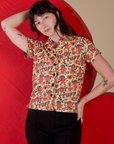 Alex is wearing a buttoned up Hot Stuff Print Pantry Button-Up