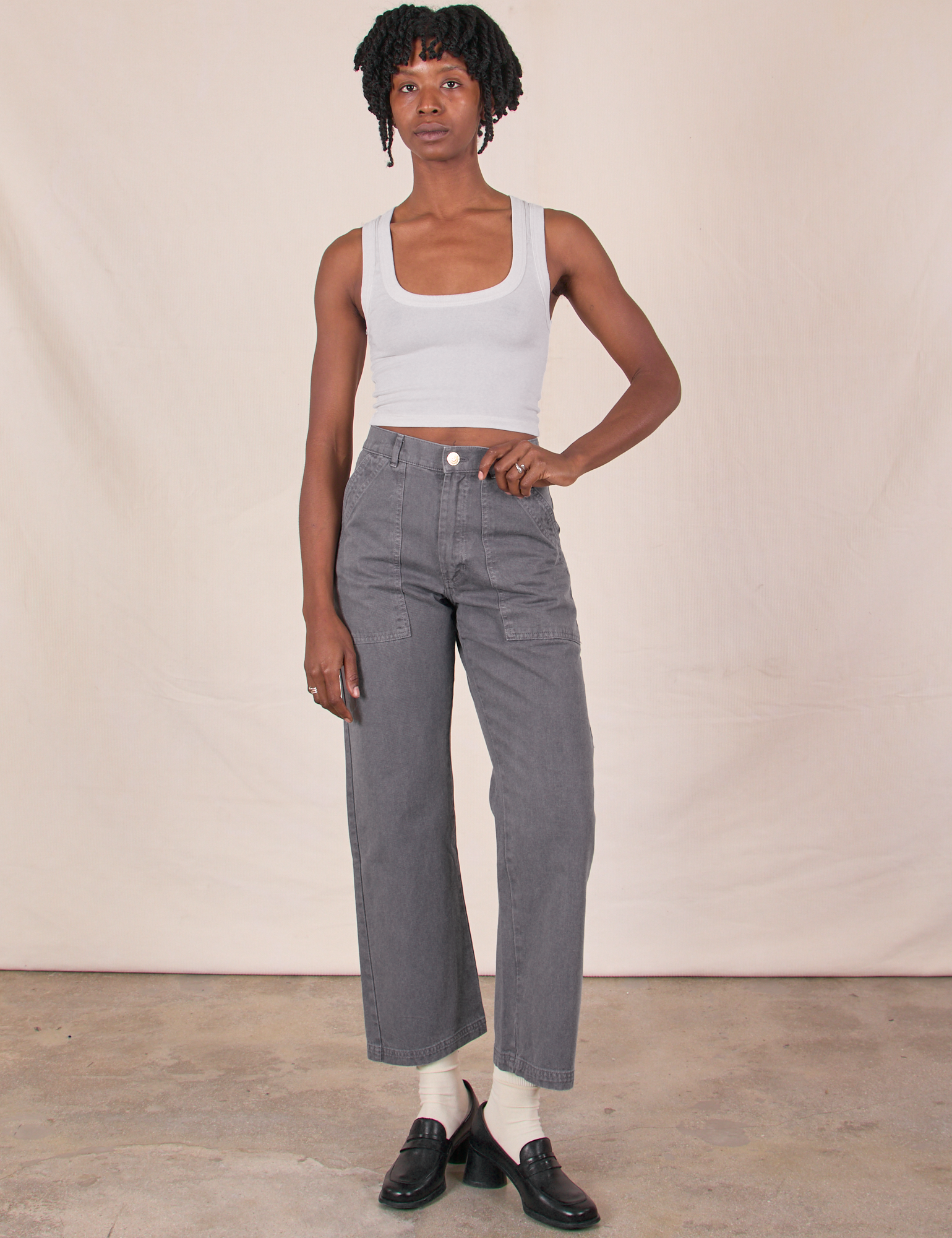 Cheyann is 5'11" and wearing XS Work Pants in Washed Grey paired with a Cropped Tank in Vintage Tee Off-White