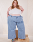 Catie is 5'11" and wearing 4XL Indigo Wide Leg Trousers in Light Wash paired with vintage off-white Cami