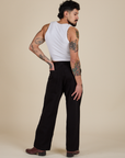 Back view of Work Pants in Basic Black and vintage tee white Cropped Tank