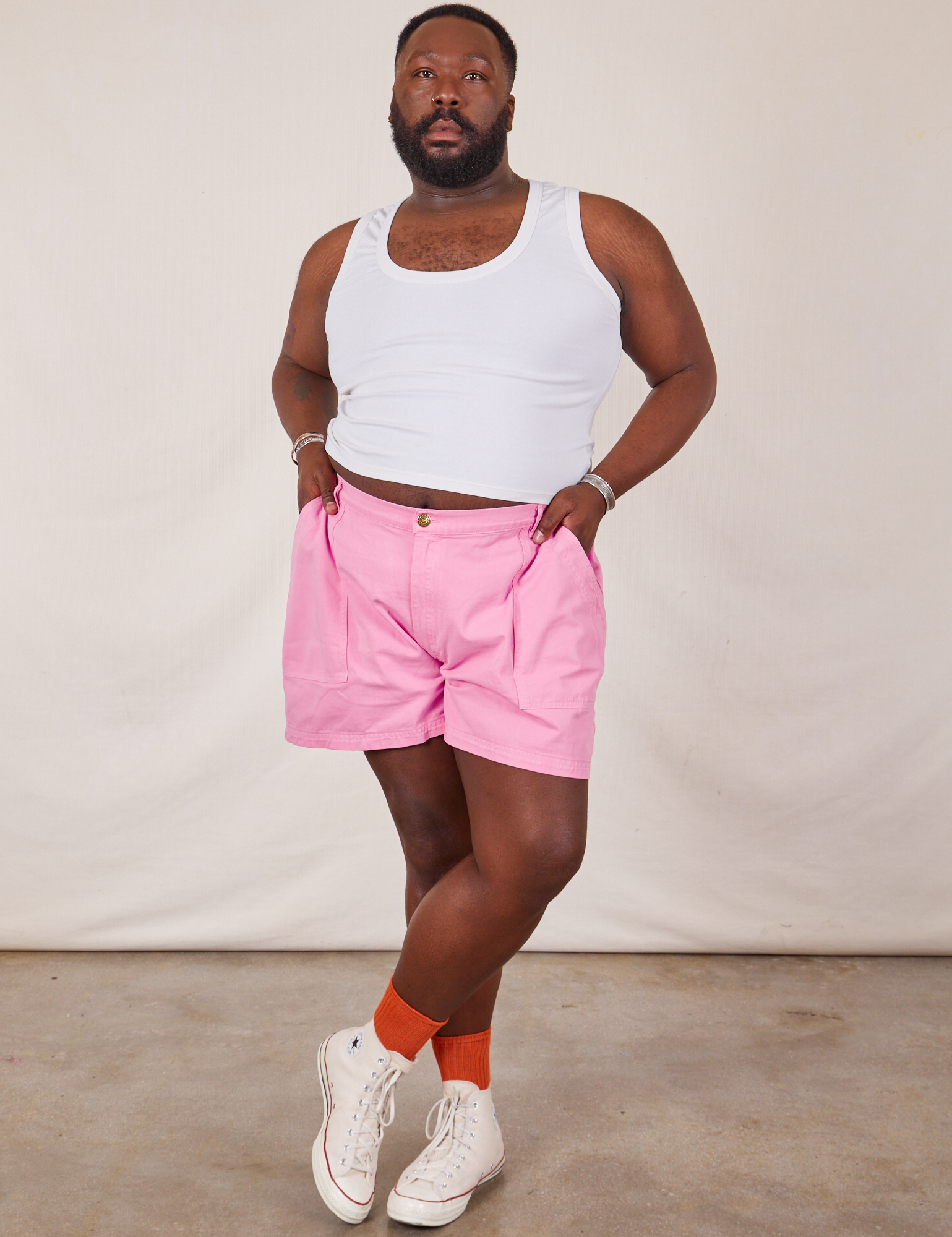 Elijah is 6’0” and wearing 3XL Classic Work Shorts in Bubblegum Pink paired with Cropped Tank Top in vintage tee off-white 