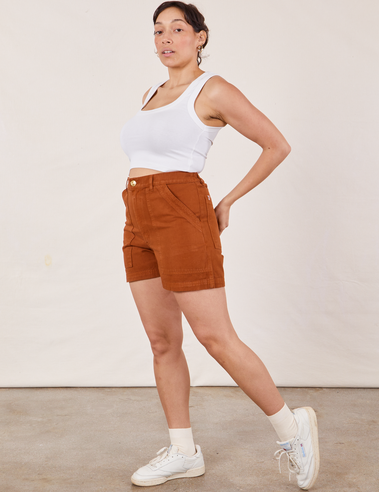 Side view of Classic Work Shorts in Burnt Terracotta and Cropped Tank Top in vintage tee off-white on Tiaira
