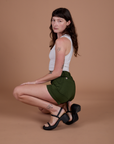 Side view of Classic Work Shorts in Evergreen and Cropped Tank in Vintage Tee White on Alex