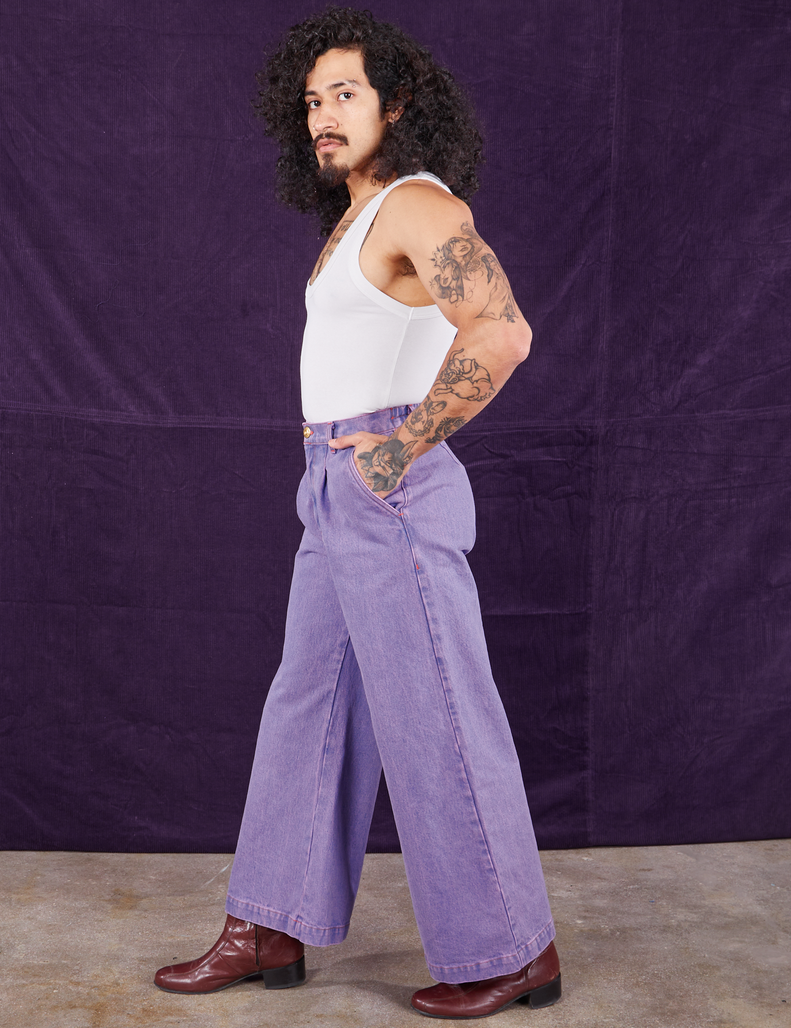 Side view of Overdyed Wide Leg Trousers in Faded Grape and Cropped Tank Top in vintage tee off-white on Jesse