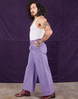 Side view of Overdyed Wide Leg Trousers in Faded Grape and Cropped Tank Top in vintage tee off-white on Jesse