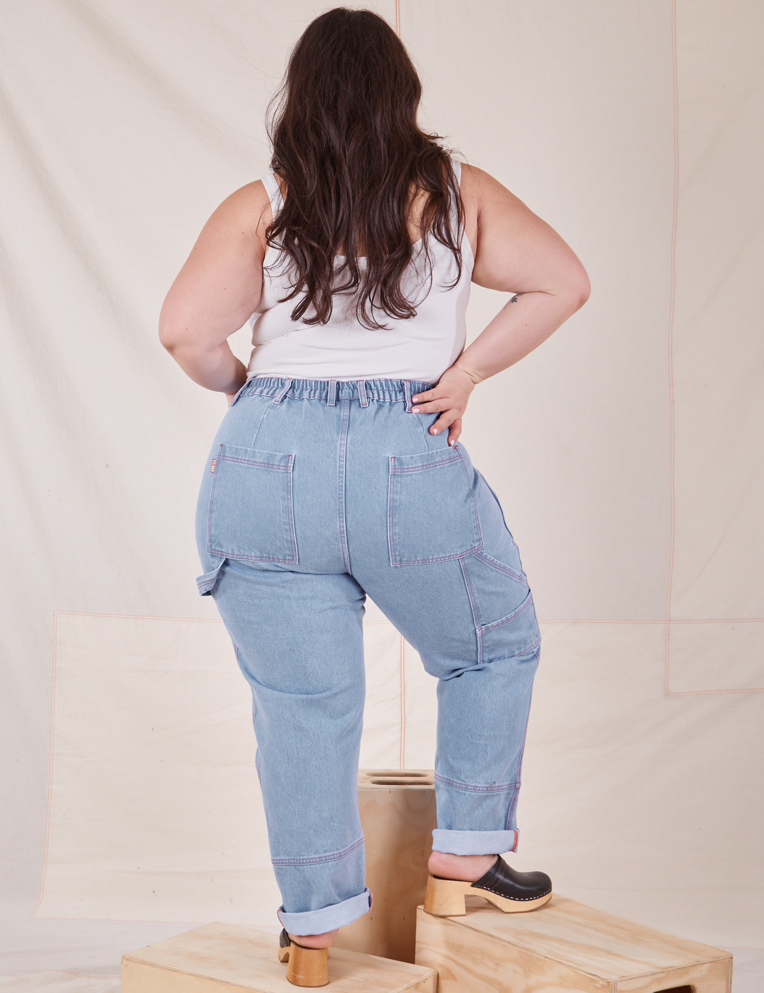 Back view of Carpenter Jeans in Light Wash worn by Ashley