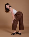 Alex is wearing Drop Pocket Cargo Pants in Fudgesicle Brown and Cropped Tank in vintage tee white