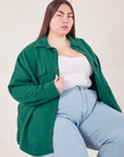 Marielena is wearing Flannel Overshirt in Hunter Green, vintage off-white Cropped Tank Top and light wash Trouser Jeans