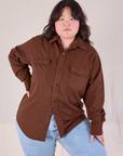 Ashley is wearing a buttoned up Flannel Overshirt in Fudgesicle Brown