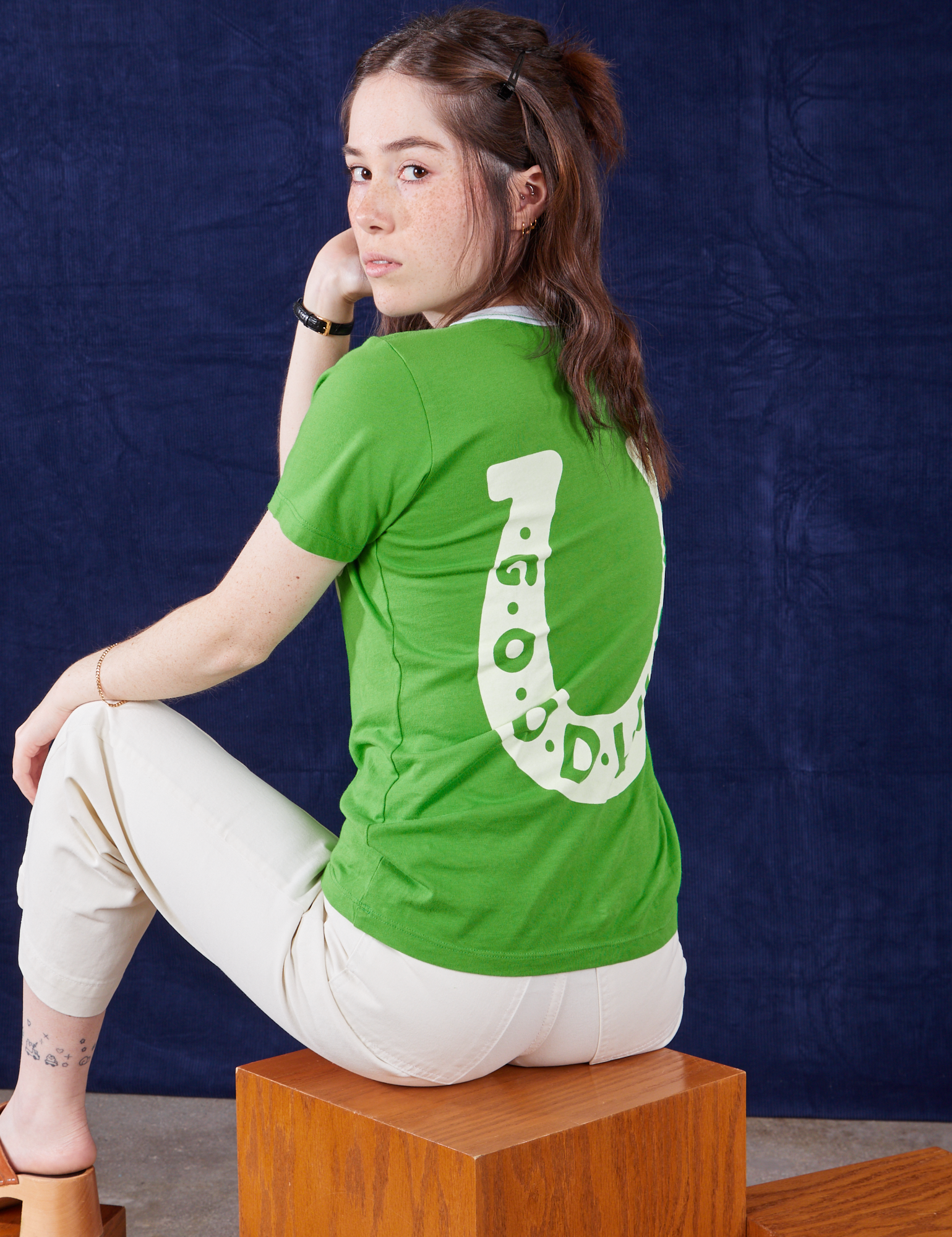 Hana is wearing the Luck Tee paired with vintage tee off-white Petite Western Pants