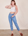 Alex is wearing Halter Top in Vintage Tee Off-White and light wash Frontier Jeans