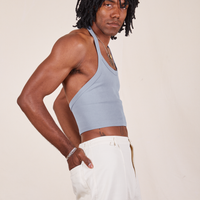 Side view of Halter Top in Periwinkle and vintage off-white Western Pants worn by Jerrod