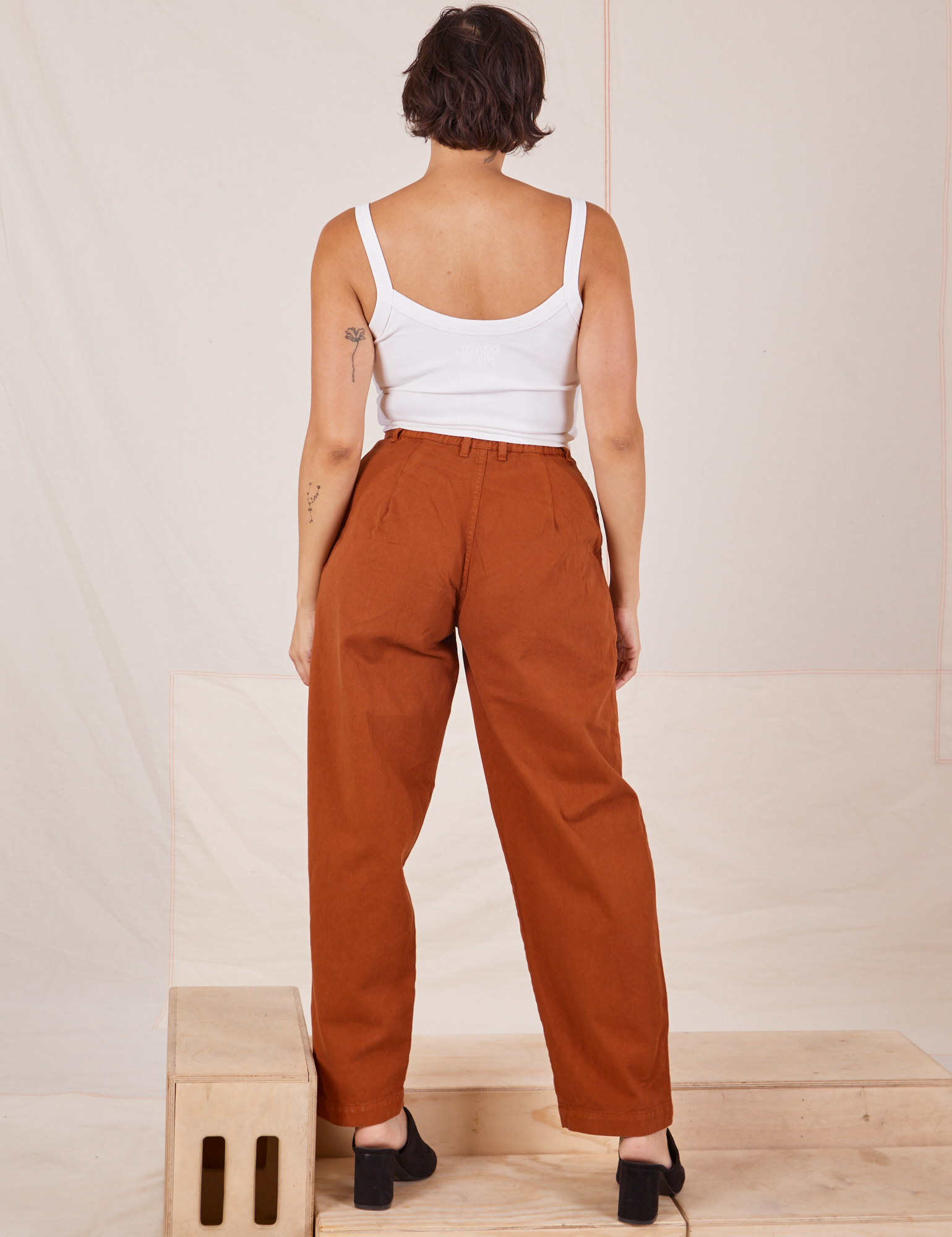 Back view of Heavyweight Trousers in Burnt Terracotta and Cropped Cami in vintage tee off-white by Tiara
