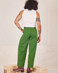 Back view of Heavyweight Trousers in Lawn Green and Sleeveless Turtleneck in vintage tee off-white worn by Jesse