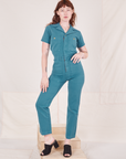 Alex is 5'8" and wearing size XS Heritage Short Sleeve Jumpsuit in Marine Blue