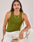 Anthony is wearing Racerback Tank in Summer Olive