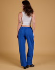 Baggy Mid-Rise Trousers in Royal Blue back view on Alex