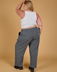 Back view of Baggy Mid-Rise Trousers in Slate Grey and vintage tee white Cropped Tank on Juliet