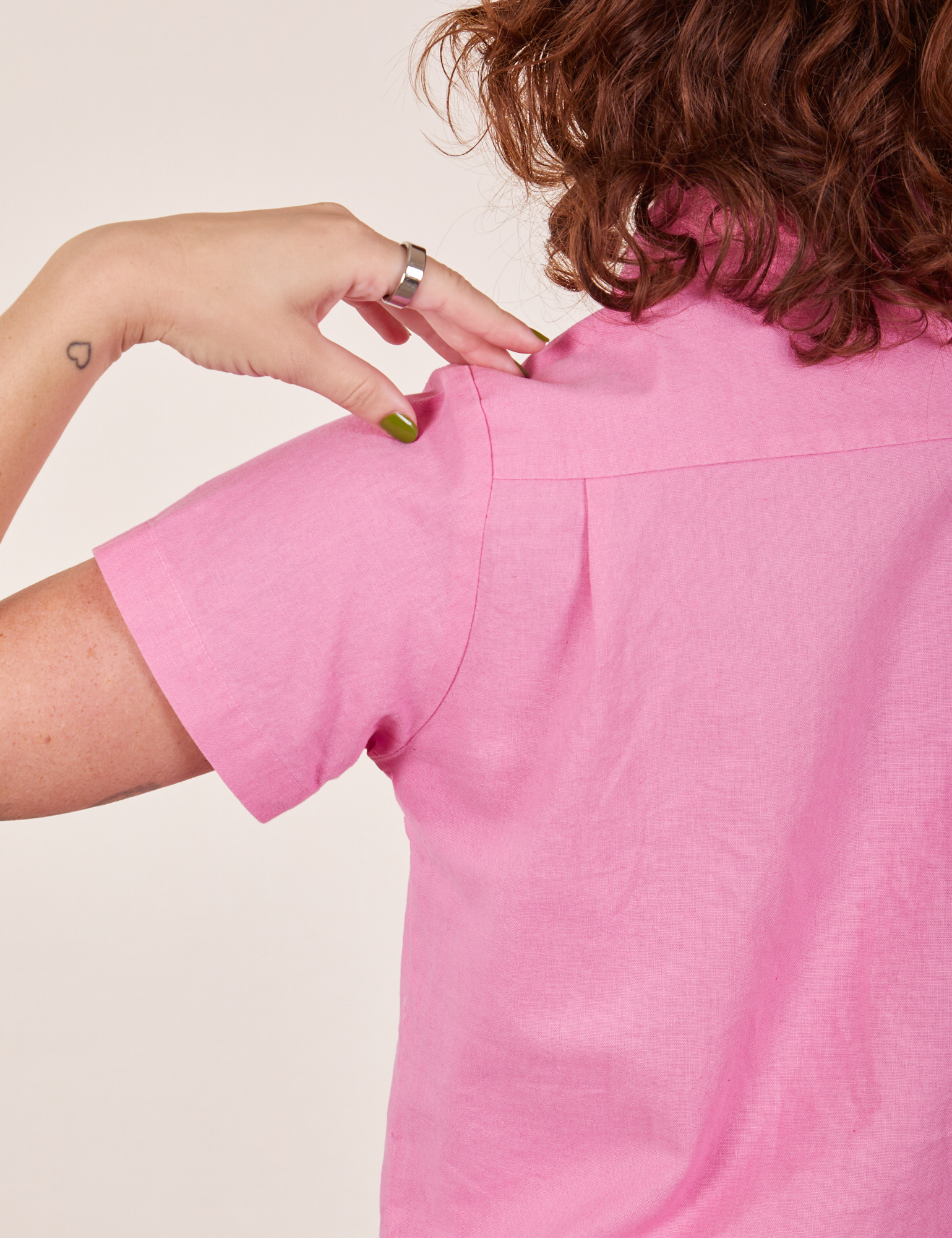 Back close up of Pantry Button-Up in Bubblegum Pink worn by Alex