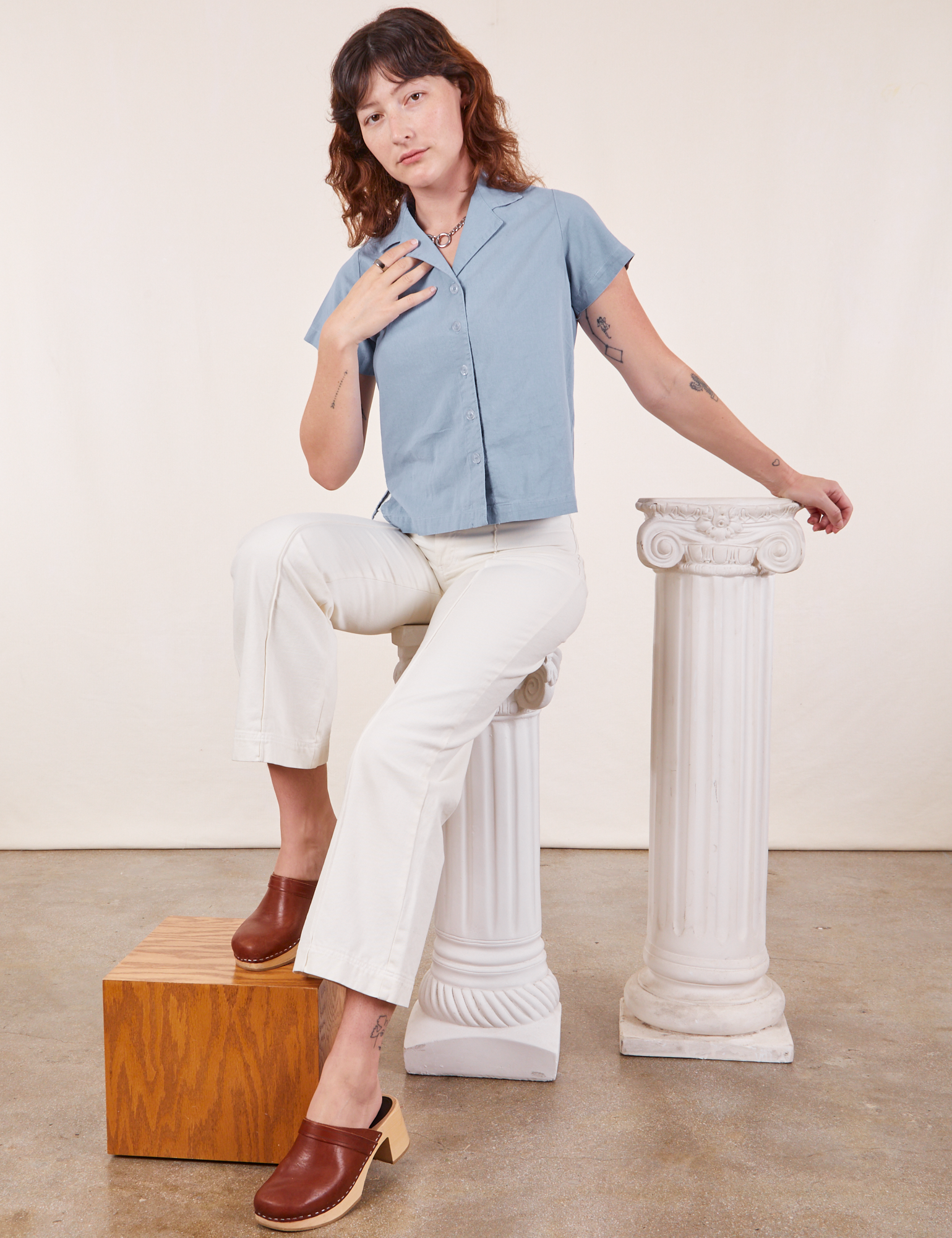 Alex is wearing Pantry Button-Up in Periwinkle and vintage tee off-white Western Pants