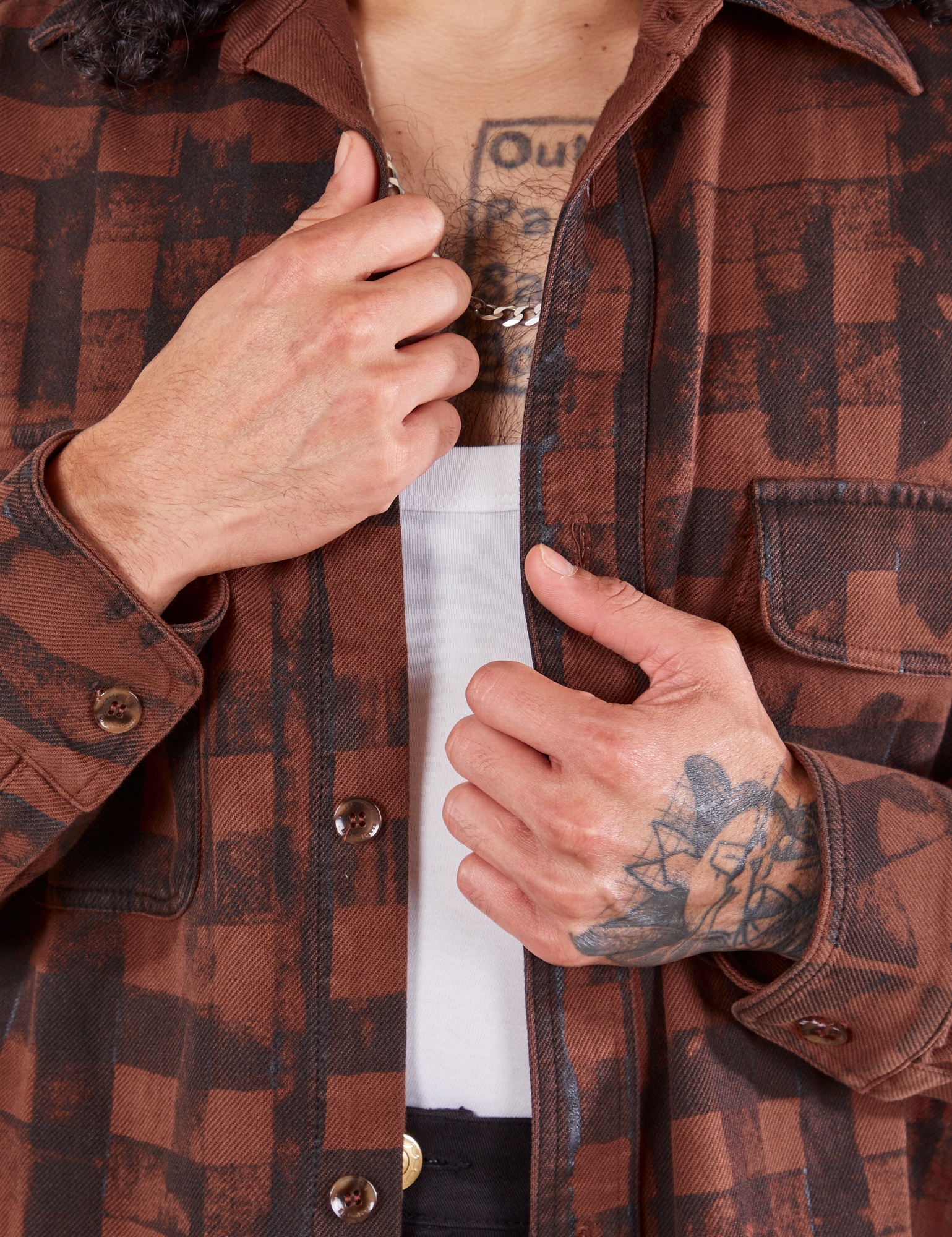 Plaid Flannel Overshirt in Fudgesicle Brown front close up on Jesse