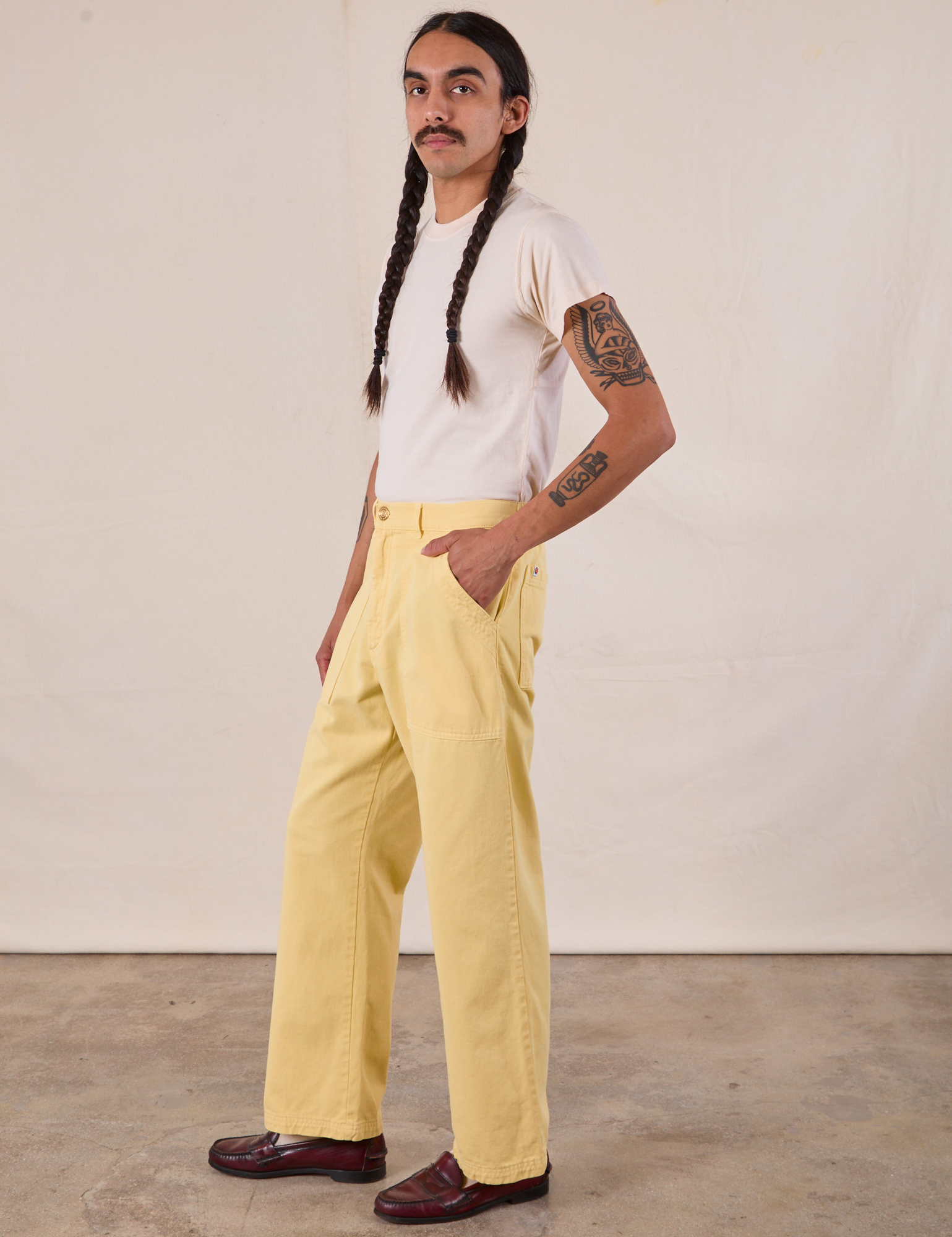 Work Pants in Butter Yellow side view on Anthony