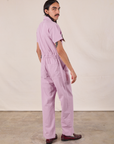 Short Sleeve Jumpsuit in Lilac angled back view on Anthony