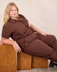 Juliet is wearing Short Sleeve Jumpsuit in Fudgesicle Brown