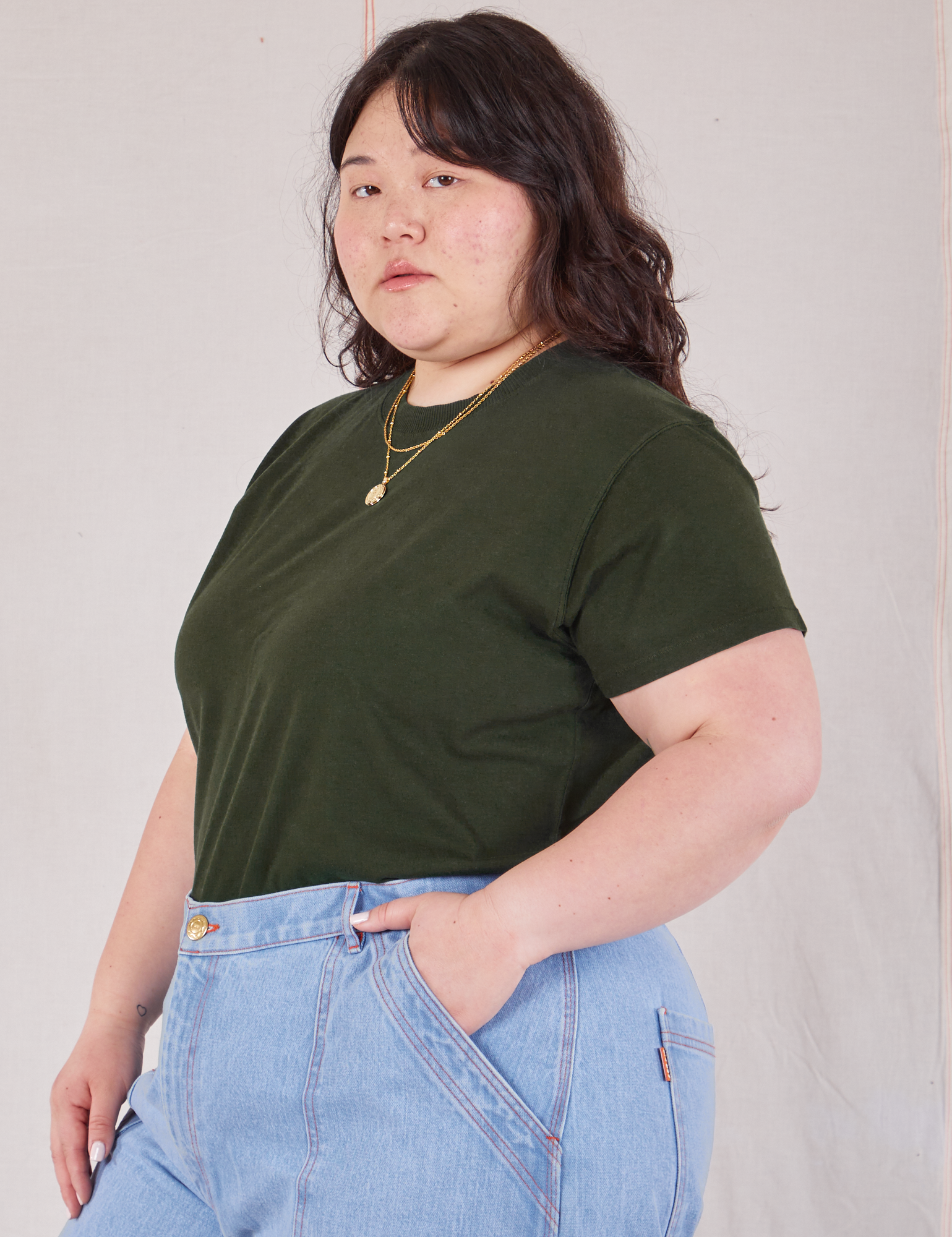 Organic Vintage Tee in Swamp Green angled front view on Ashley