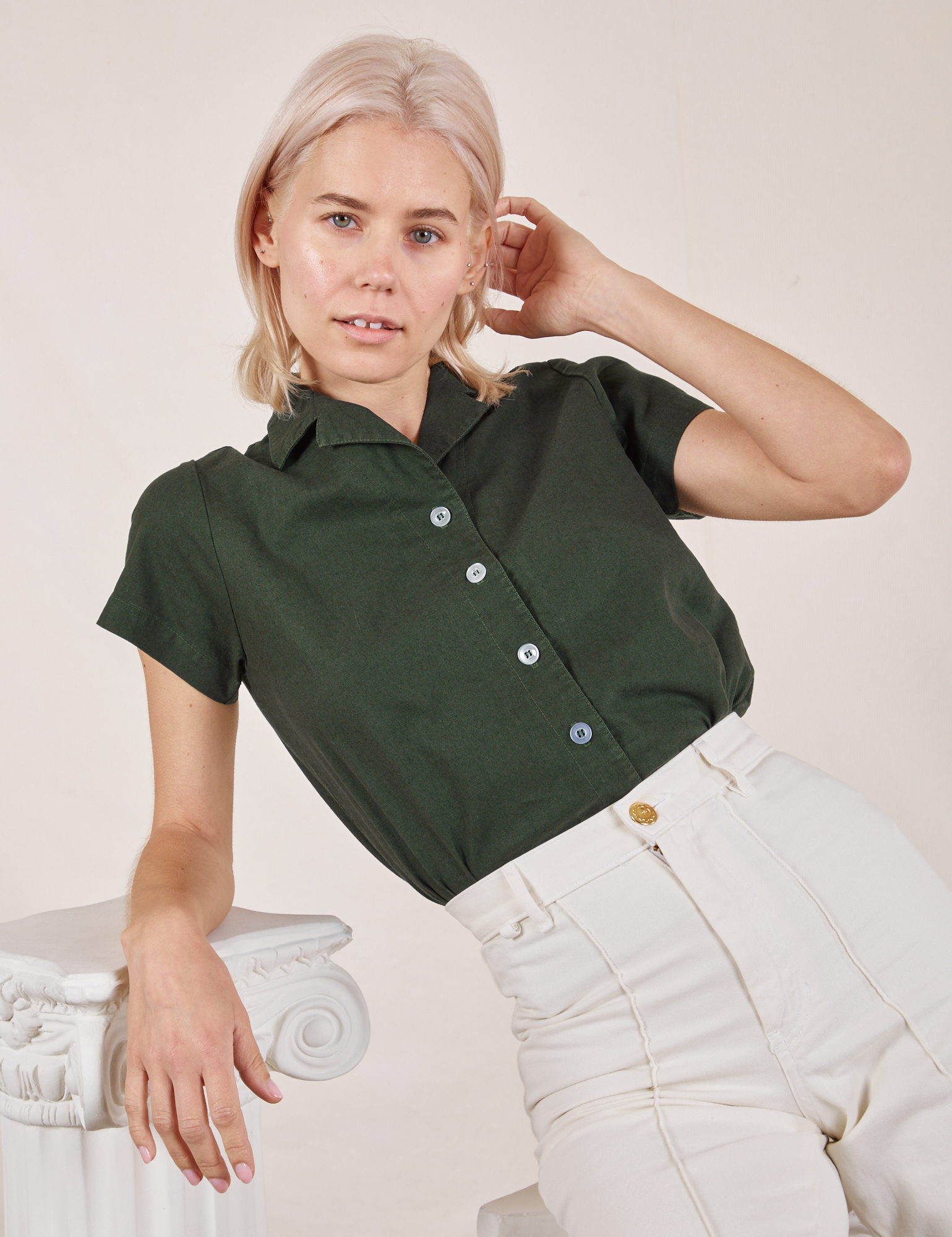 Madeline is wearing Pantry Button-Up in Swamp Green and vintage tee off-white Western Pants
