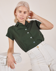 Madeline is wearing Pantry Button-Up in Swamp Green and vintage tee off-white Western Pants