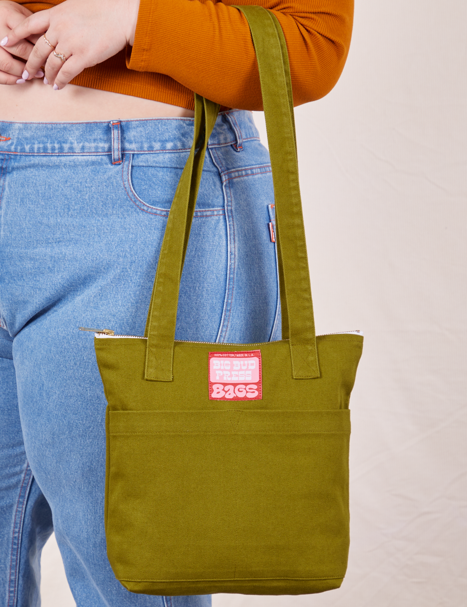 Over-Shoulder Zip Mini Tote in Olive Ground on model&#39;s arm
