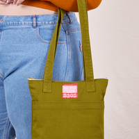 Over-Shoulder Zip Mini Tote in Olive Ground on model's arm