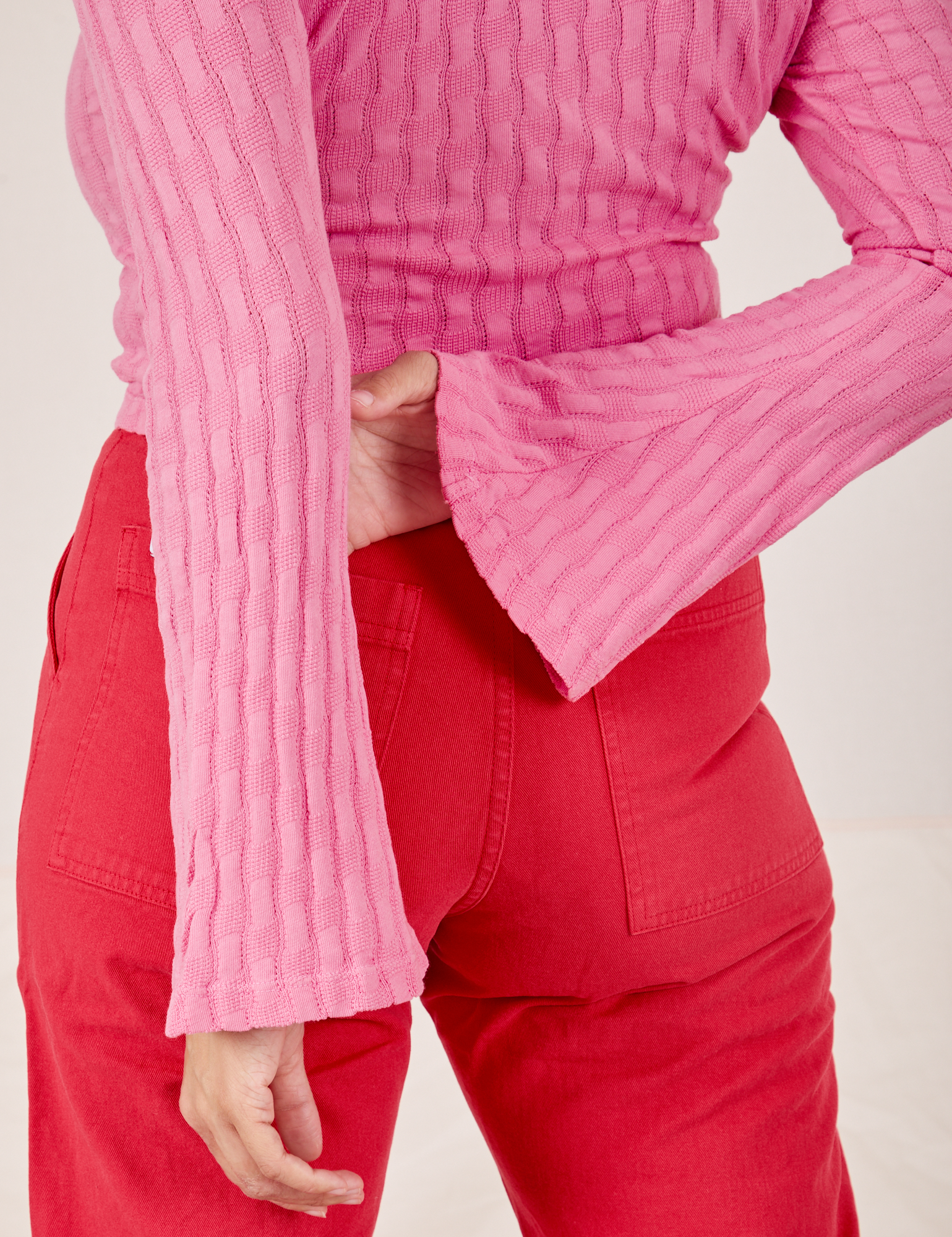Back close up of Bell Sleeve Top in Bubblegum Pink worn by Tiara