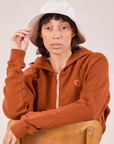 Tiara is wearing Wide Brim Denim Bucket Hats in Vintage Tee Off-White