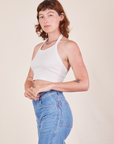 Side view of Halter Top in Vintage Tee Off-White and light wash Frontier Jeans worn by Alex