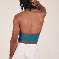 Back view of Halter Top in Marine Blue and vintage off-white Western Pants worn by Jerrod