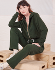 Alex is wearing Rolled Cuff Sweat Pants in Swamp Green and matching Cropped Zip Hoodie.