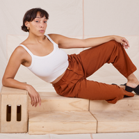 Tiara is wearing Heavyweight Trousers in Burnt Terracotta and vintage off-white Cropped Cami