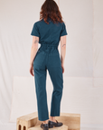 Heritage Short Sleeve Jumpsuit in Lagoon back view on Alex