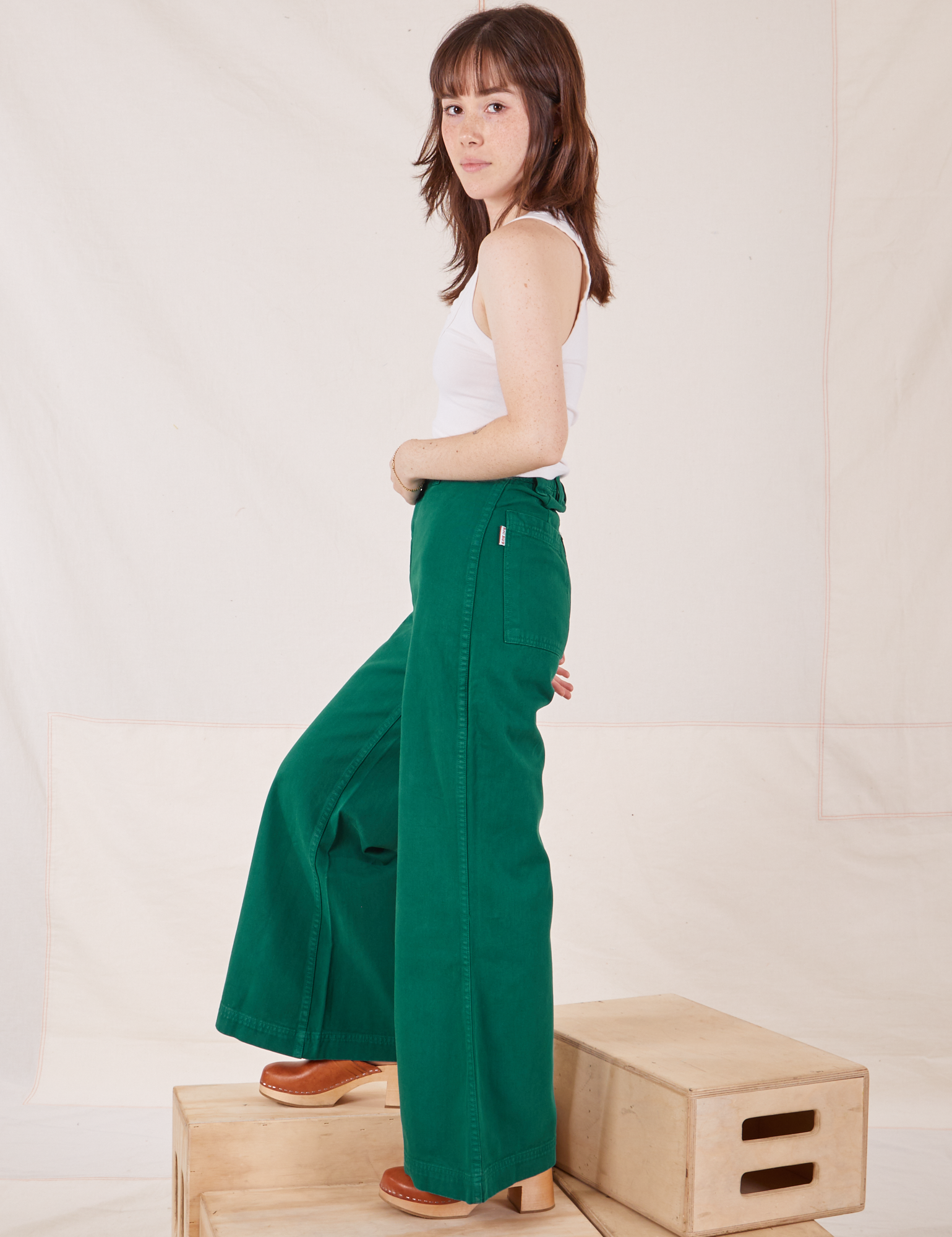 Side view of Bell Bottoms in Hunter Green worn by Hana