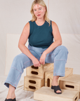 Lish is wearing Muscle Tee in Lagoon and light wash Carpenter Jeans
